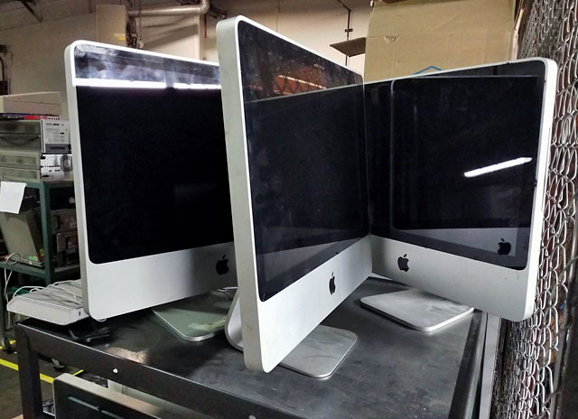 Three aluminum iMacs await their fate of either being resold and reused or recycled at an electronics recycling center in downtown Fort Wayne, Indiana near the home of a member of the Low End Mac Facebook group.