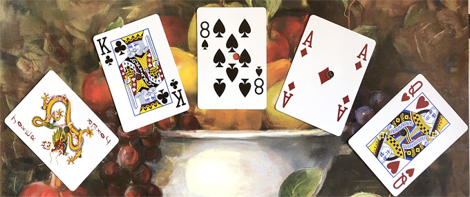 poker hand: Joker, King of Clubs, 8 of Spades, Ace of Diamonds, Queen of Hearts