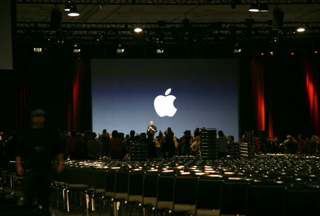 Steve Jobs poses for the cameras with the iPhone in hand at the end of his Keynote address at the Macworld Expo in San Francisco on January 9, 2007